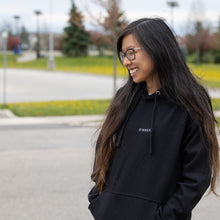 Load image into Gallery viewer, woman modeling black hoodie with embroidered black text, "MT913" and white text, "Sinner."