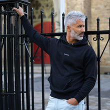 Load image into Gallery viewer, man modeling black hoodie with embroidered black text, "MT913," and white text, "Sinner." Also wearing blue jeans.